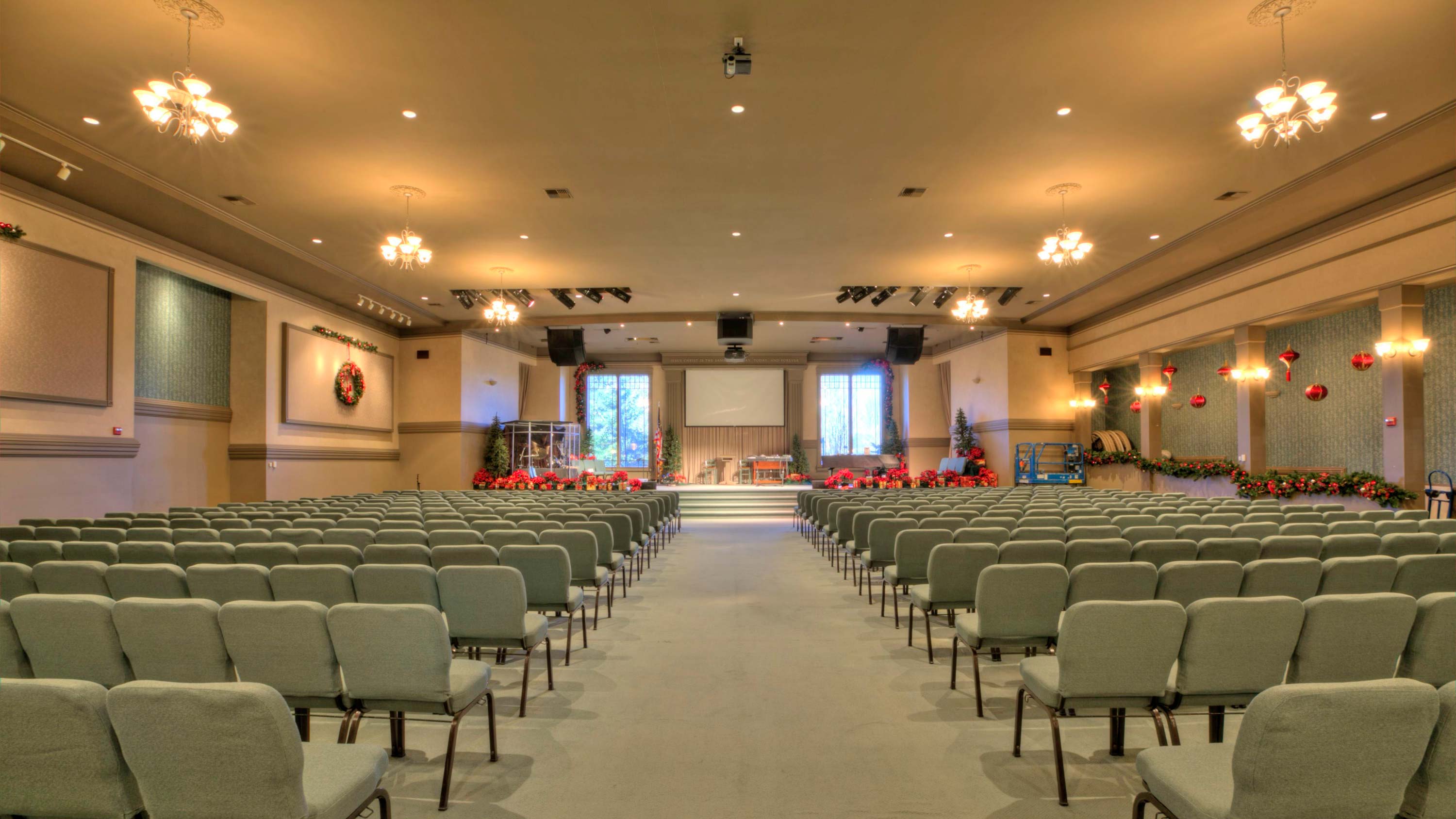 Worship center, green chairs, lighting, curtains