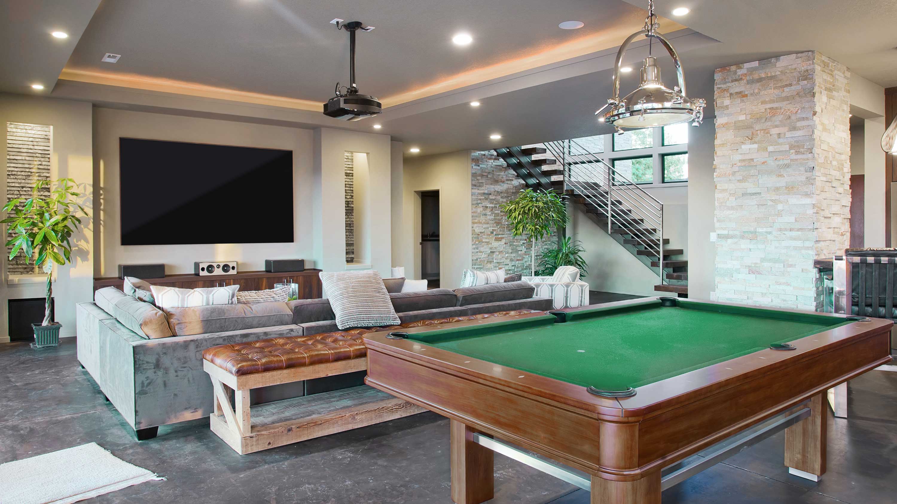 Pool table with green felt, projector, game room, stairs