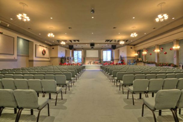 Pale green chairs facing stage