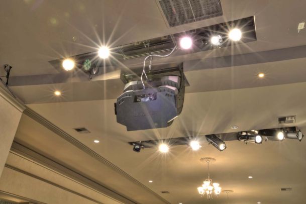 Up close view of speakers and lightings on ceiling