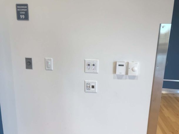 Panels and switches on white wall