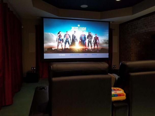 Justice league showing on large home theater screen