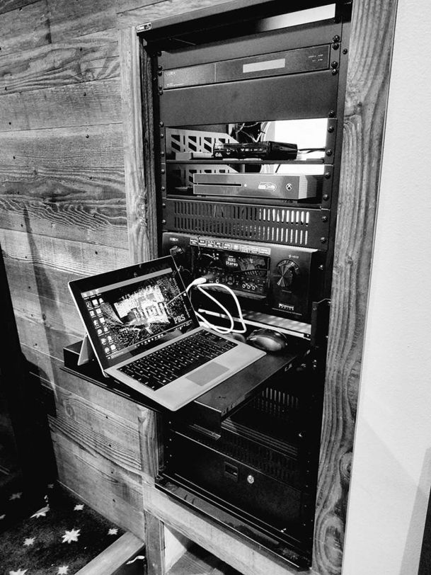 Black and white image of distribution center with laptop